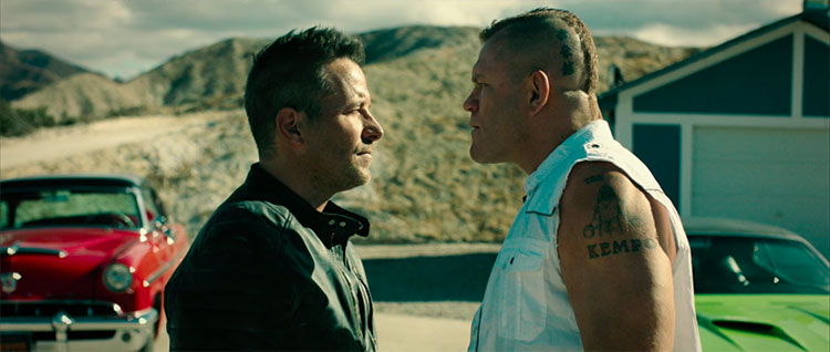 A tense exchange between Frank (Johnny Messner) and Nelson (Chuck Liddell).